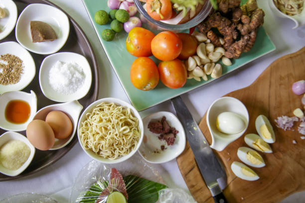 istock Different herbs, spices and food ingredients on the kitchen table, top view 1221968721