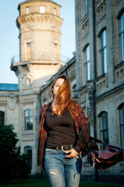 istock student girl near the university building 1221970774