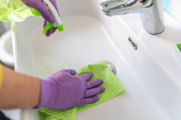 istock Bathroom sink disinfection in protective gloves 1221971386