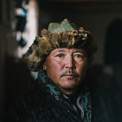 Portrait of Mongolian man in traditional clothes
