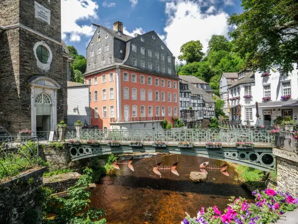 View of the medieval city of Monschau (Germany) on a summer day and the Ruhr river