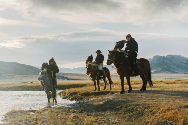 istock Eagle hunters near the river in Mongolia 1221973488