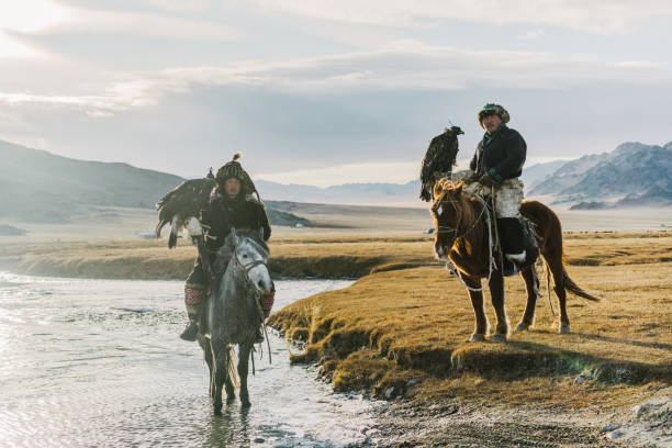 istock Eagle hunters near the river in Mongolia 1221974045