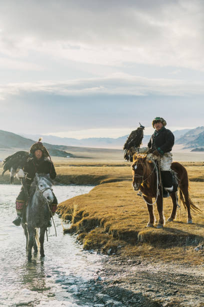 istock Eagle hunters near the river in Mongolia 1221974048