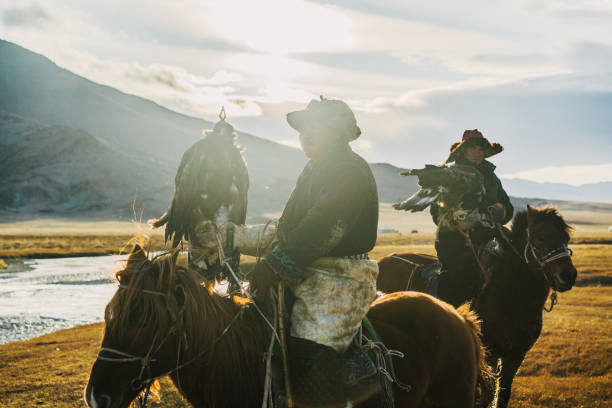 istock Eagle hunters near the river in Mongolia 1221974932