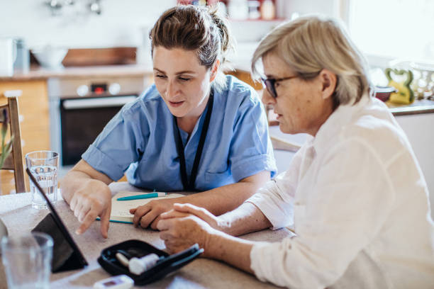 istock District nurse at home visit 1221975125