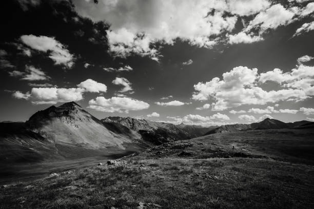 A wide mountain meadow landscape in French Alpes Black and White stock photo