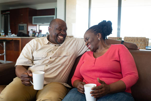 istock Happily Retired Having a hot drink and laugh Together 1221976921