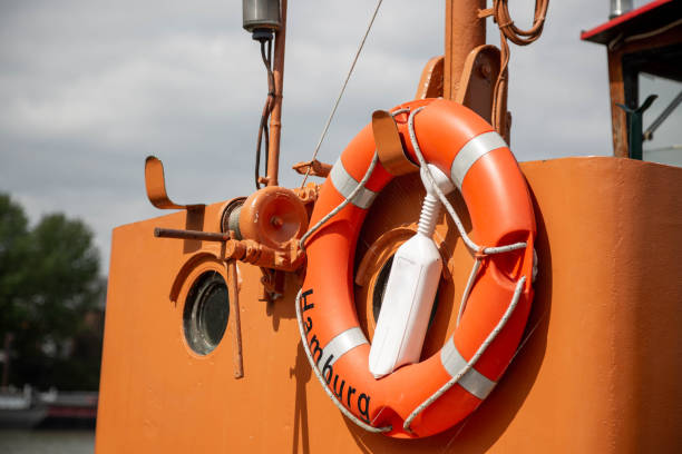 Lifebuoy with the name of the city of Hamburg in front of an orange ship's cab