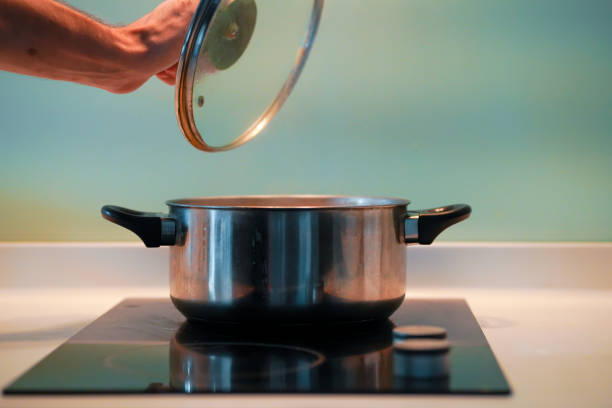 istock Cooking soup in a pan on an induction stove. 1221979192
