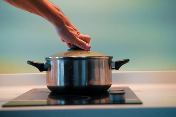 istock Cooking soup in a pan on an induction stove. 1221979262
