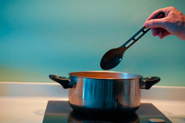 istock Cooking soup in a pan on an induction stove. 1221979900