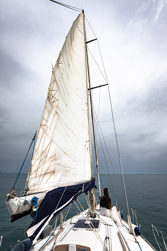 woman traveling with a sailing boat in Italy