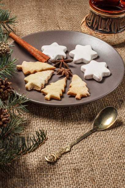 istock Gingerbread cookies in Christmas tree and star shape on plate 1221980611