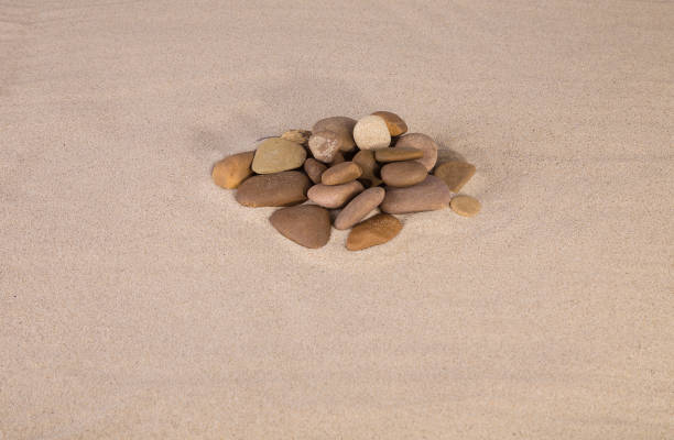 istock Heap of rocks on the sand. 1221980739