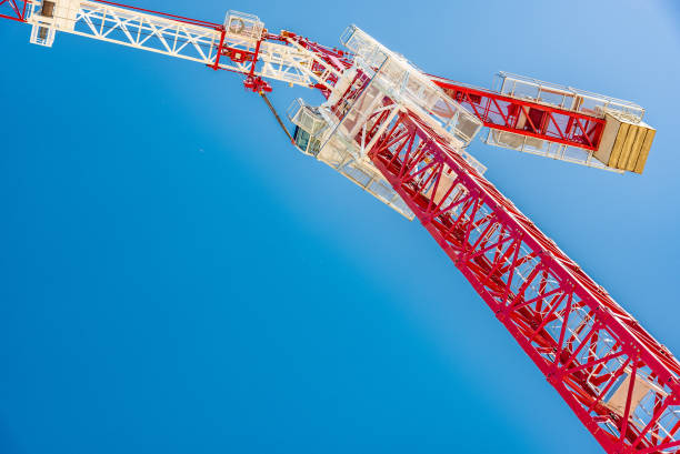 istock Tower crane, red against the sky and mountains 1221981834