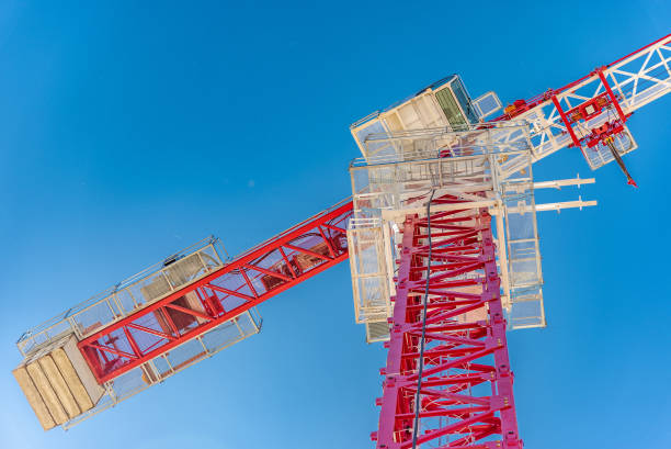 istock Tower crane, red against the sky and mountains 1221981906