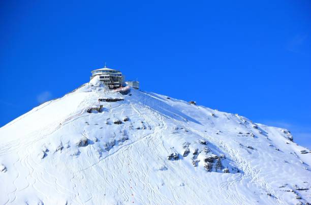 schilthorn's summit, 2970 m, with the piz gloria.  bernese alps of switzerland, europe. - monch sun snow european alps imagens e fotografias de stock