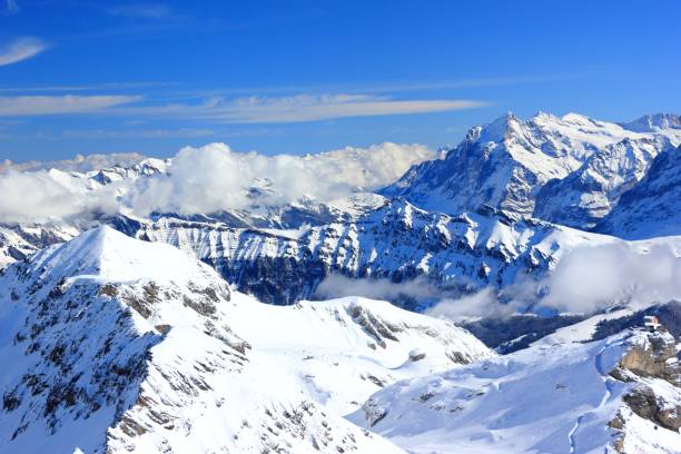 view of alps from schilthorn. bernese alps of switzerland, europe. - monch sun snow european alps imagens e fotografias de stock