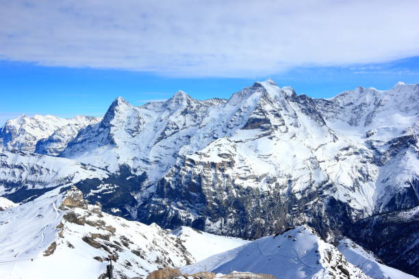 view of eiger, mönch and jungfrau from schilthorn. bernese alps of switzerland, europe. - monch sun snow european alps imagens e fotografias de stock