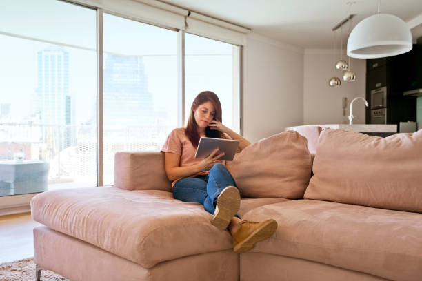 istock Woman using digital tablet during lockdown due to COVID-19 1221982099