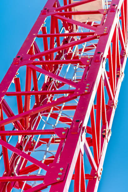 istock Tower crane, red against the sky and mountains 1221982823
