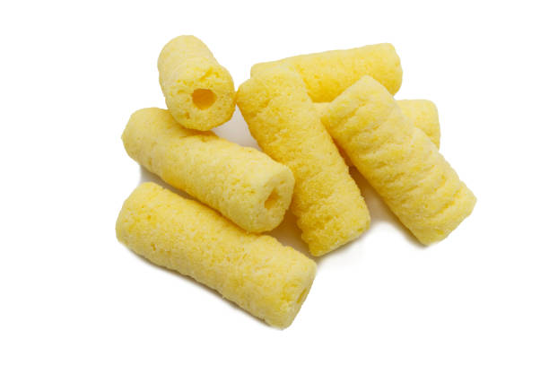 istock Handful of sweet crunchy corn sticks, snacks isolated on white background. 1221982829