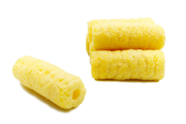 istock Handful of sweet crunchy corn sticks, snacks isolated on white background. 1221982871