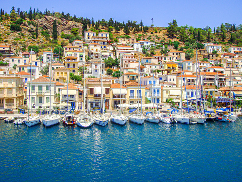 In August 2011, tourists can admire the marina of the island of Poros in Greece.