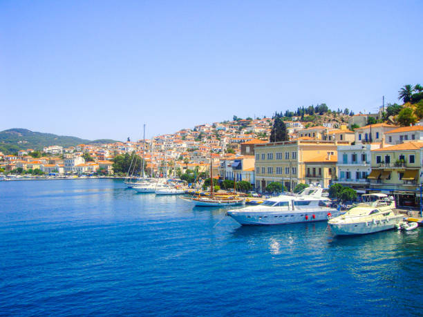 In August 2011, tourists can admire the marina of the island of Poros in Greece.