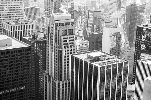 Black and white image of New York City skyscrapers and buildings viewed from a high angle