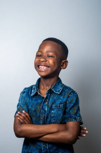 istock Cute Young Boy Portrait toothy smile 1221987363