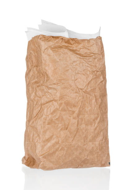 istock Crumpled paper bag close up isolated on white background 1221987434