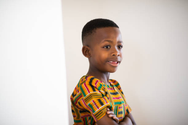 istock Cute Young Boy with traditional clothing side view Portrait 1221987521
