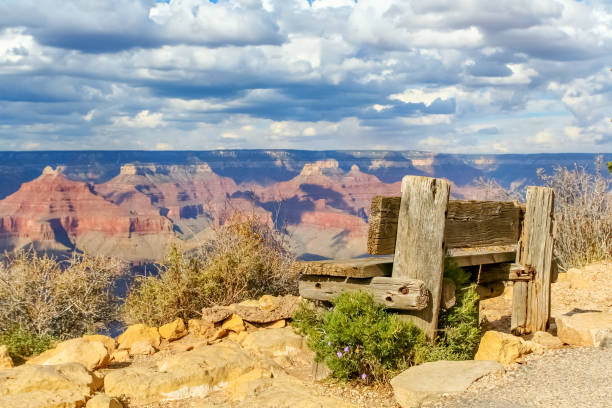 Grand Canyon, South Rim with a wooden bench seat.