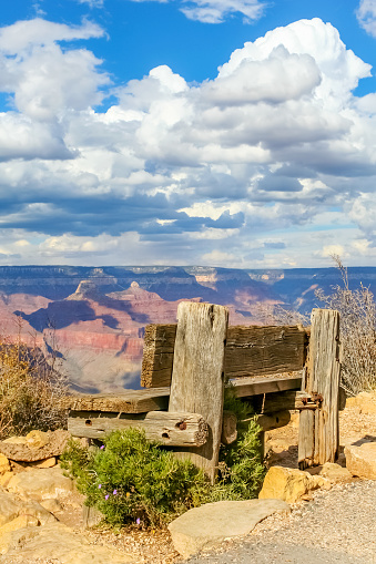 Grand Canyon, South Rim with a wooden bench seat.