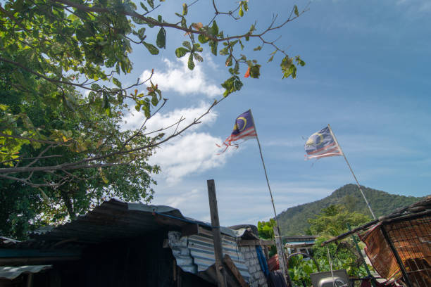 istock Two fade Malaysia flag waving. 1221987697