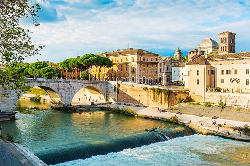 Beautiful river and stone bridge view in Rome. Rome is a famous tourist destination