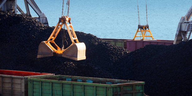 istock Sea cargo port, industrial background. Loading and unloading coal,  railway freight wagons, railroad. Cargo terminal, cranes, panoramic view 1221989259