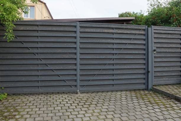 istock architecture of closed gray wooden gate 1221989591