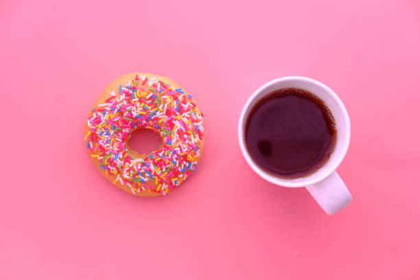 istock high angle view of donuts and coffee on table 1221989623