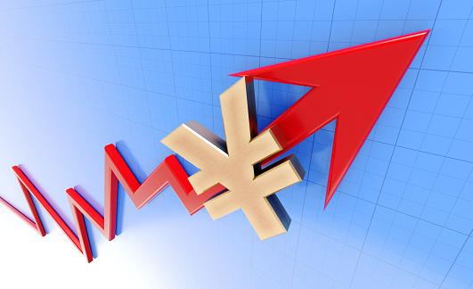 Gold colored Yen sign sitting over red arrow moving up on white background. Horizontal composition with copy space. Volatility in Yen.