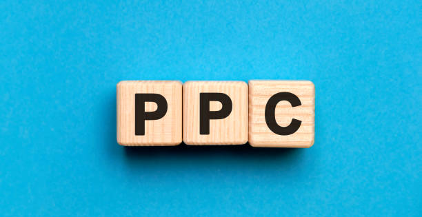 istock Ppc text on wooden cubes on a blue background 1221997094