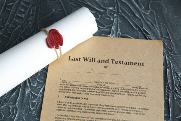 istock Notary's public pen and stamp on testament and last will. Notary public 1221997312