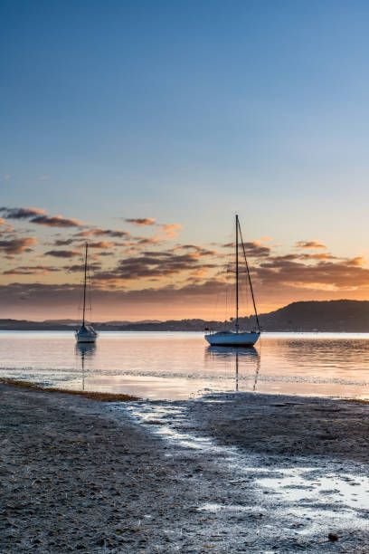 istock Boats and a Bay Sunrise Waterscape 1222002158