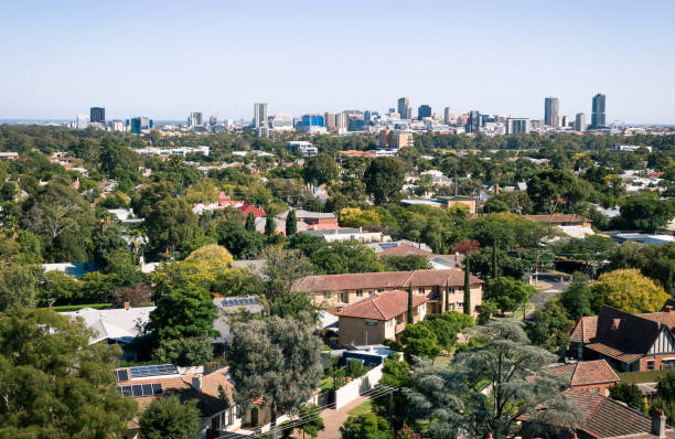 The city of Adelaide viewed from the leafy eastern suburbs The city of Adelaide viewed from above houses and flats in the green, leafy eastern suburbs solar panels on the roof of building in a city stock pictures, royalty-free photos & images