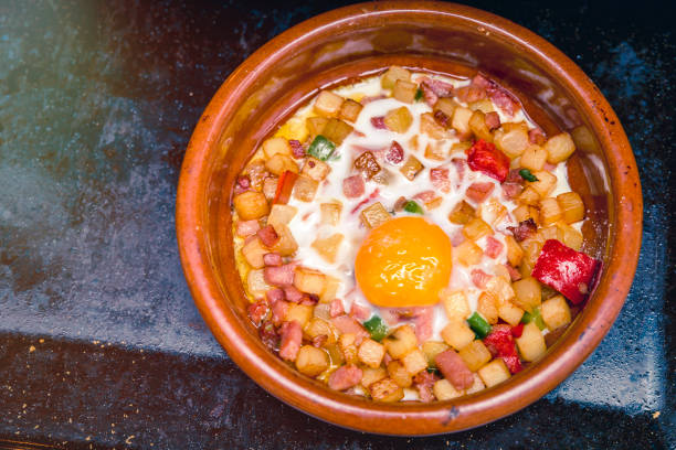 istock home cooking. baked eggs with potatoes and bacon 1222005597