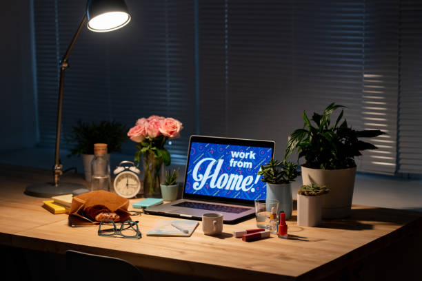 Table with working supplies and lamp over all that stuff in the darkness