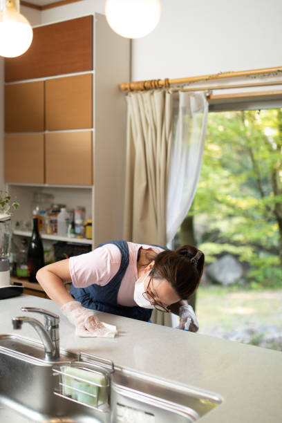 istock Wiping surfaces clean of virus 1222007917