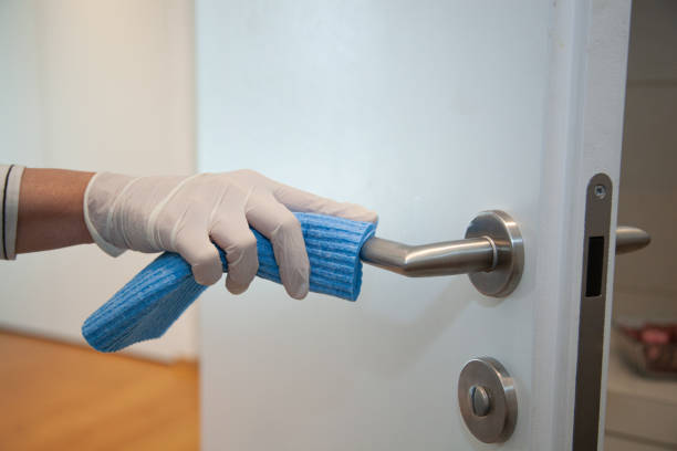 istock Disinfecting a door knob 1222012275